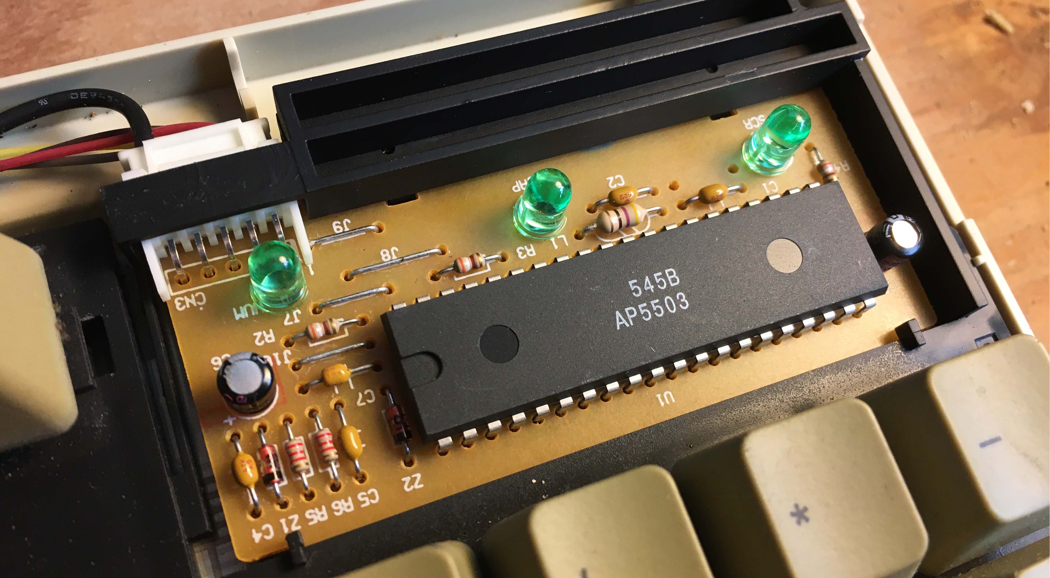 Photo of the top right where the pcb is, with a large package and smaller components.