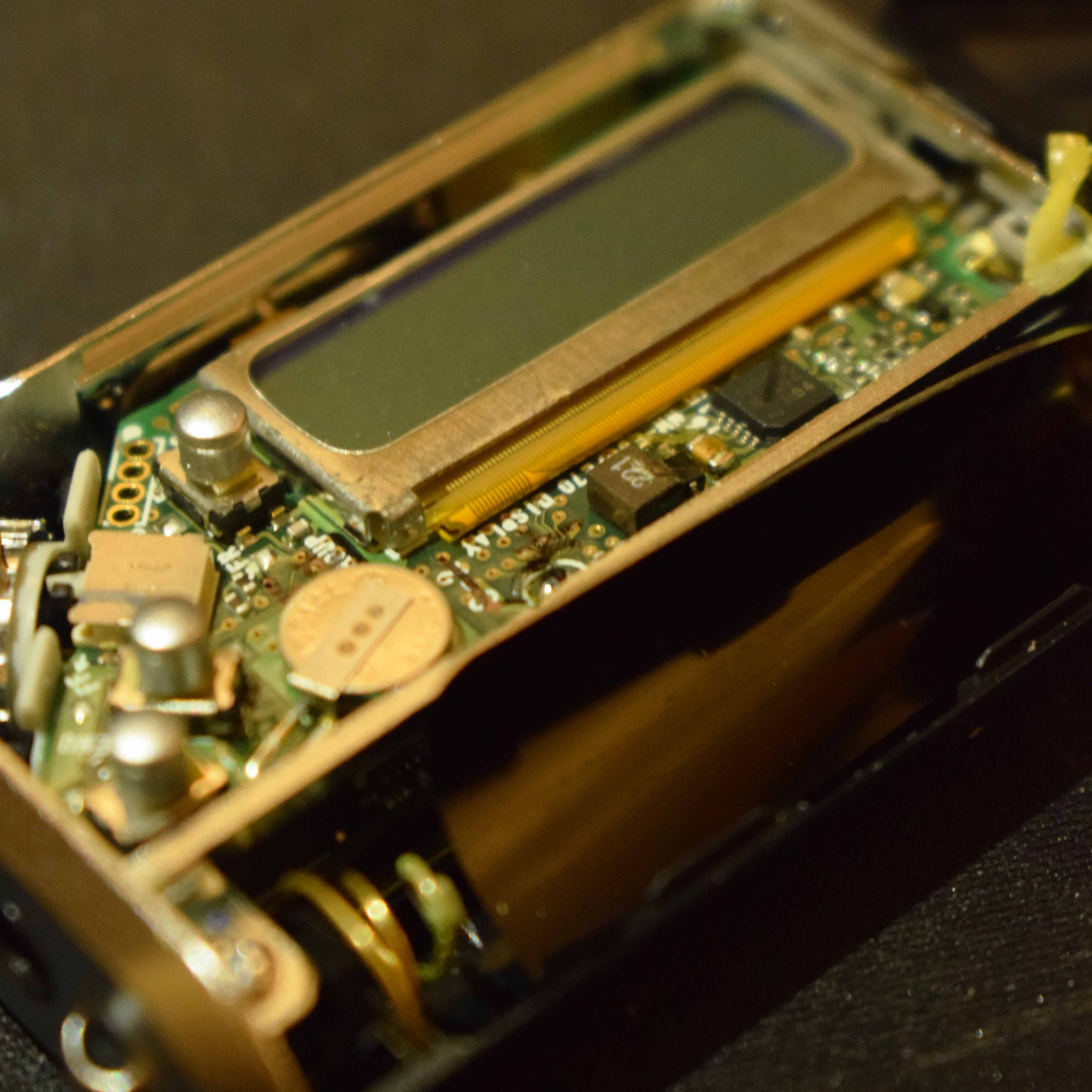 Photo of Sony NW-E95 dissasembled revealing mainboard and screen