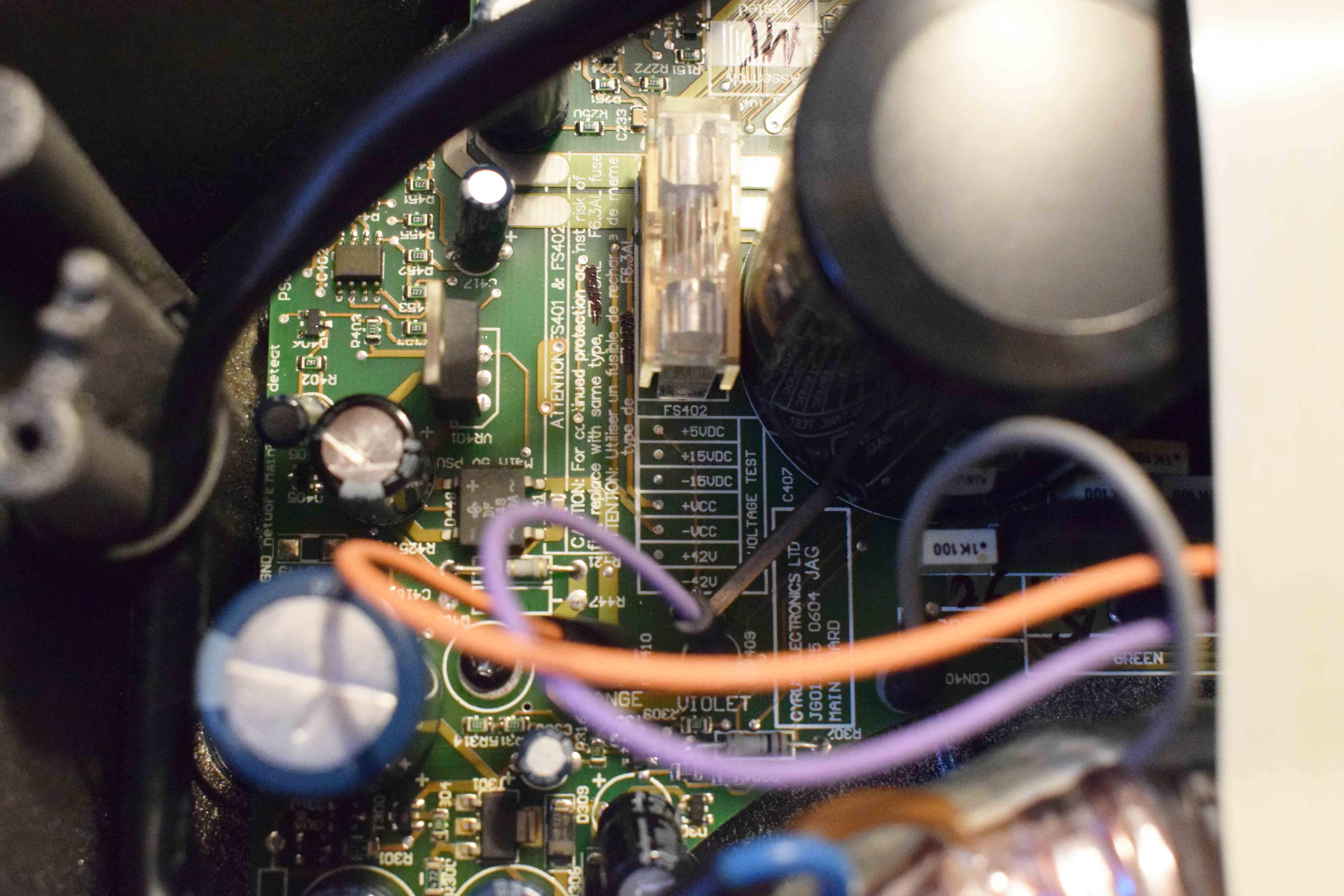 Image of PCB with test points and fuses shown.