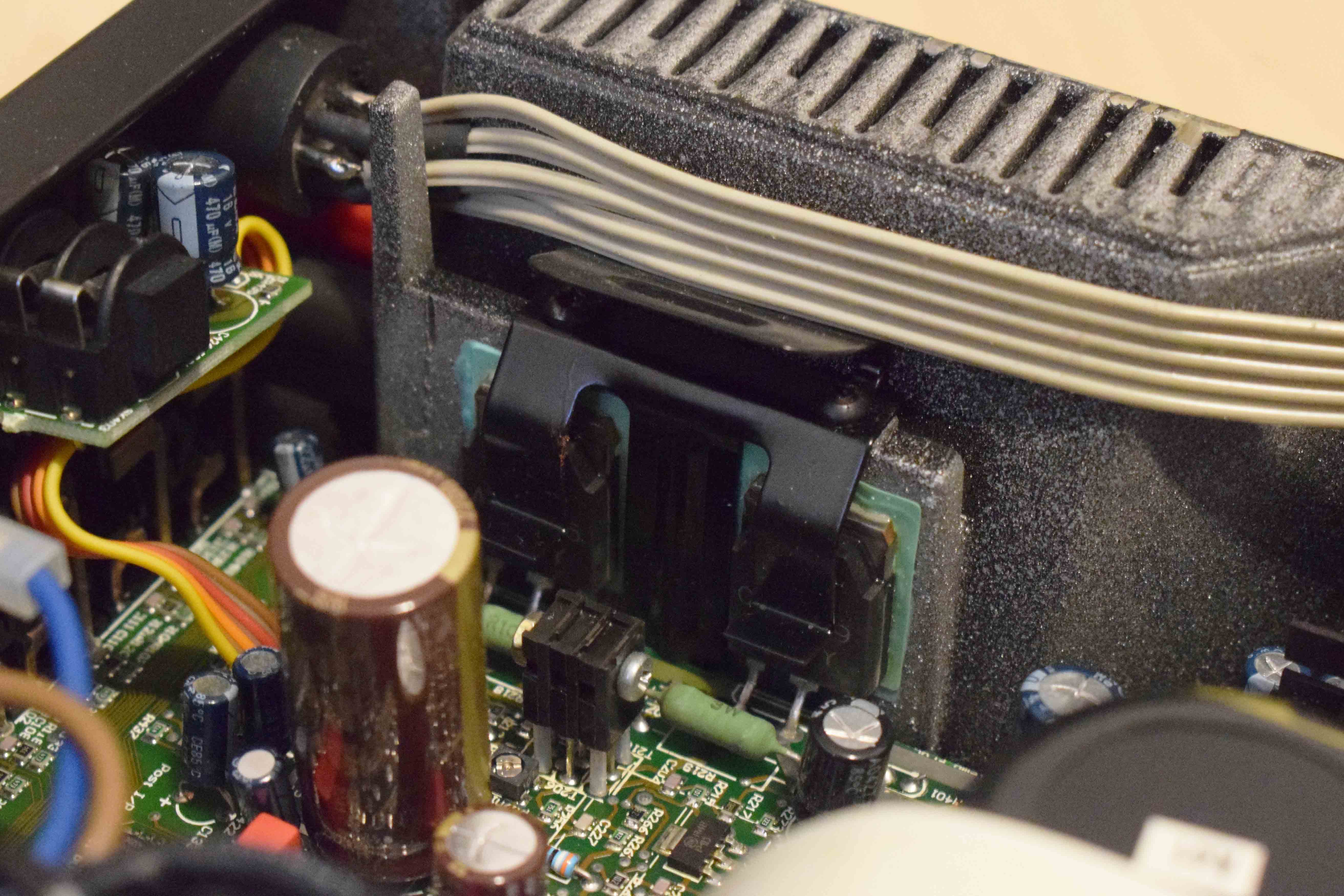 Image of FETs on the wall of case where it is being used as a heatsink.