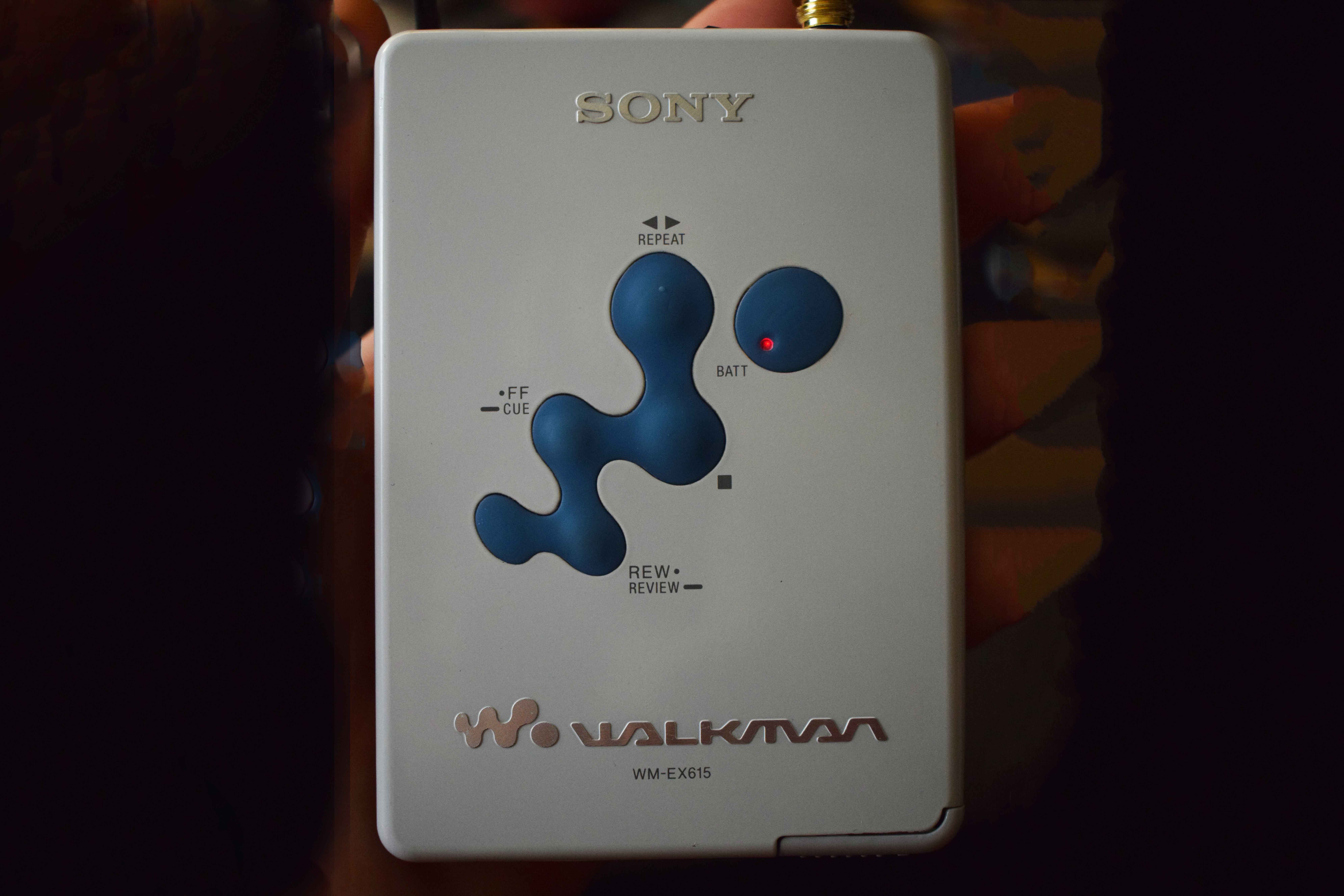 Front view of the WM-EX615 showing buttons and SONY branding.