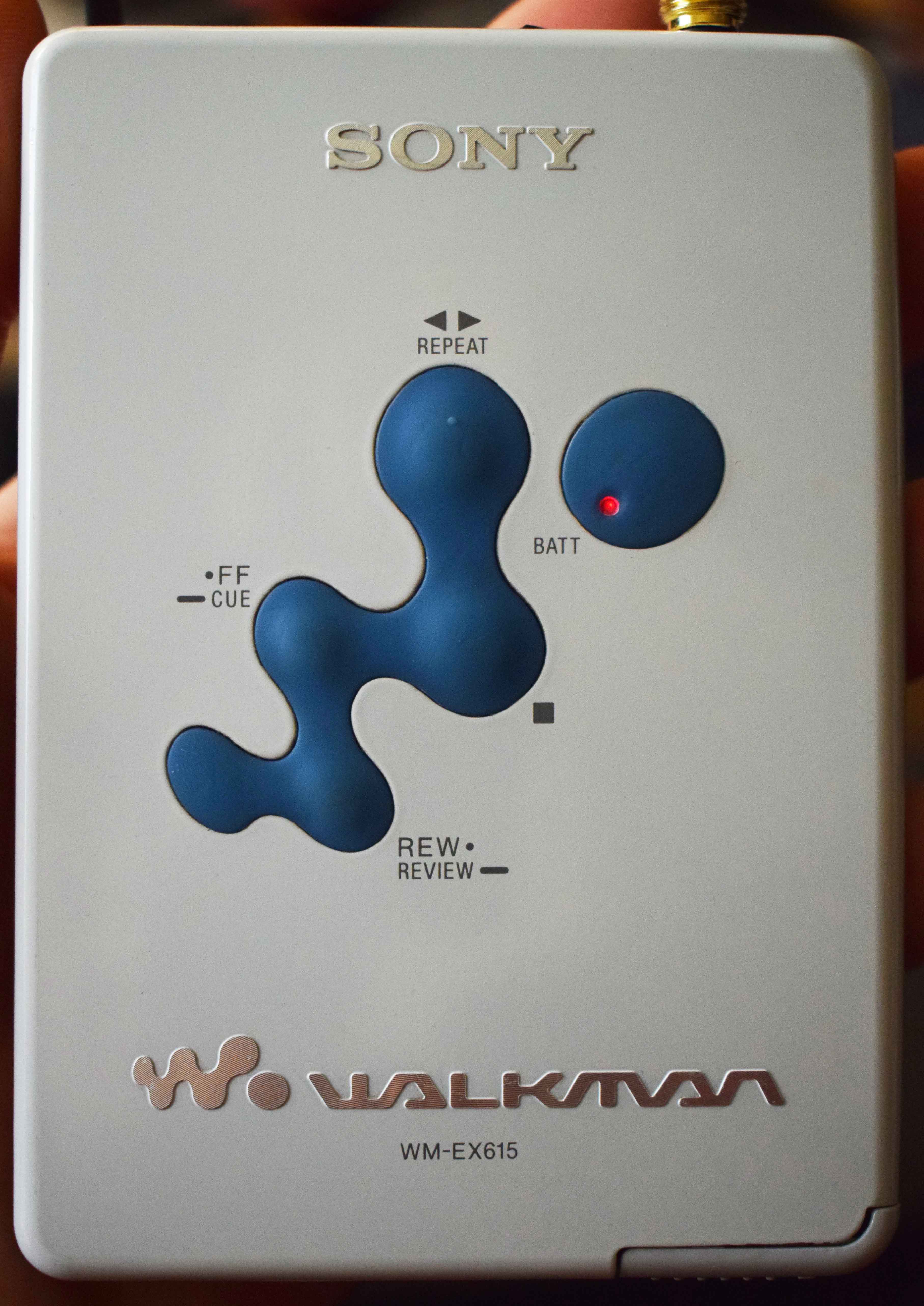 Front view of the WM-EX615 showing buttons and SONY branding.