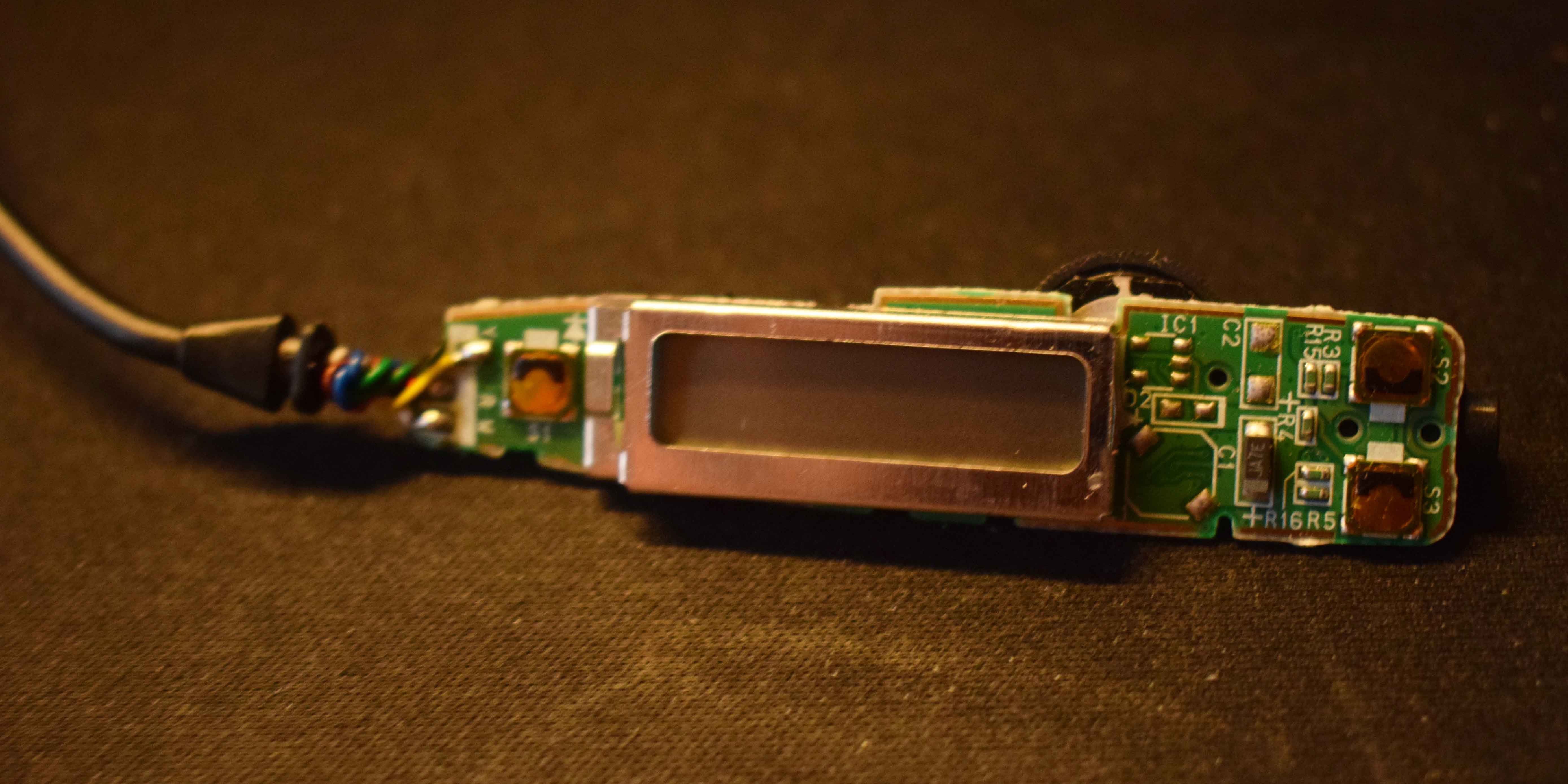 Remote control with entire housing removed, showing front side of PCB.