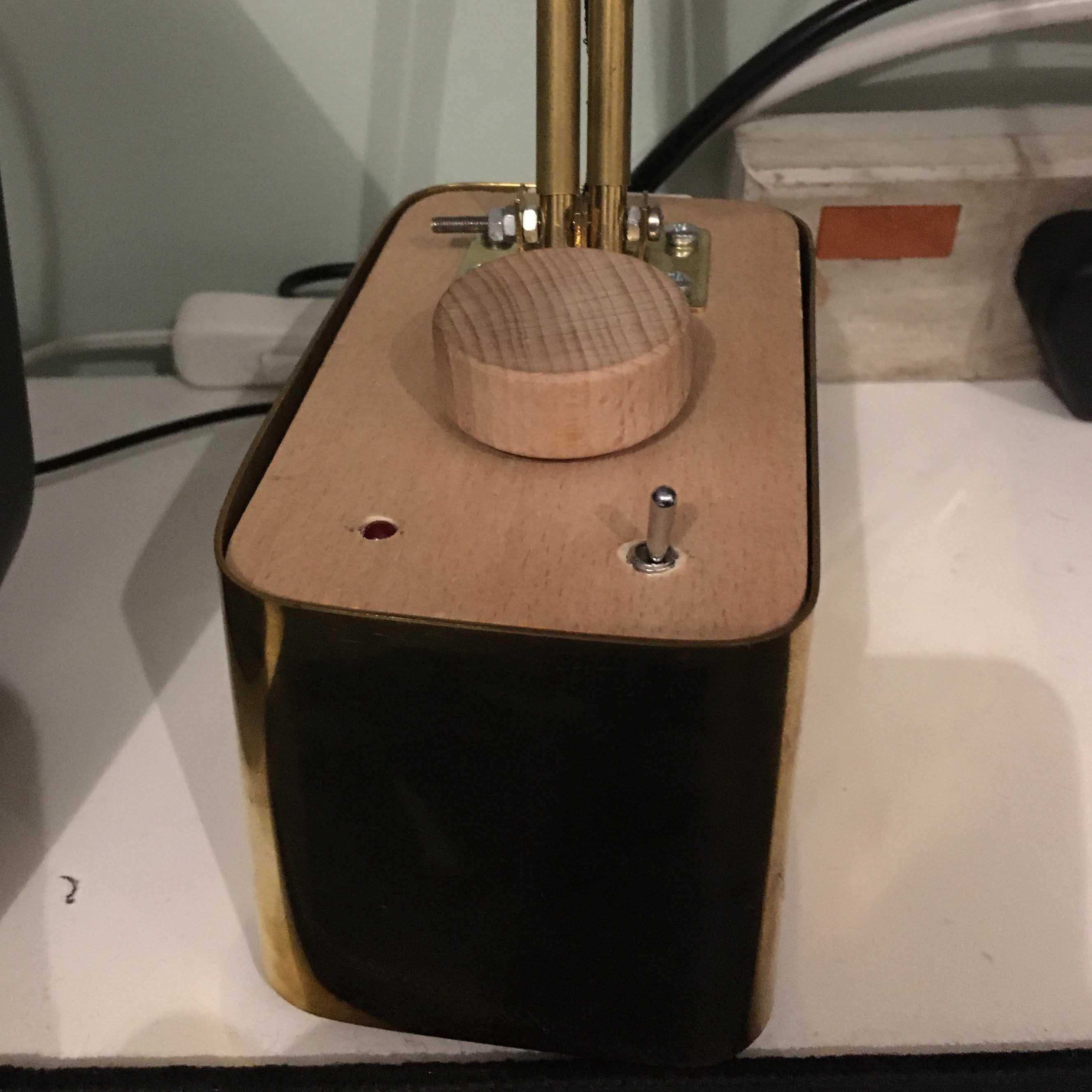 Microphone capsule suspended in brass ring